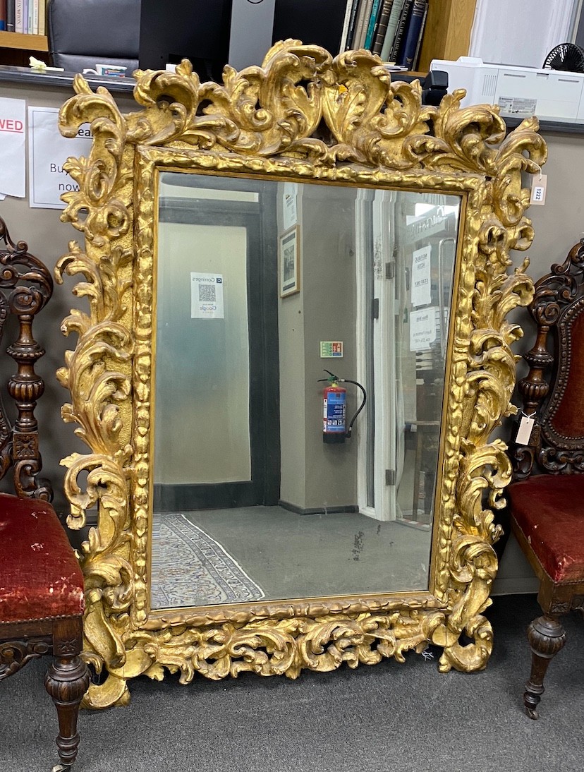 A late 18th early / 19th century rectangular carved giltwood florentine wall mirror formerly the property of Lord Bagot, Blithfield Hall, Staffordshire, width 114cm, height 152cm